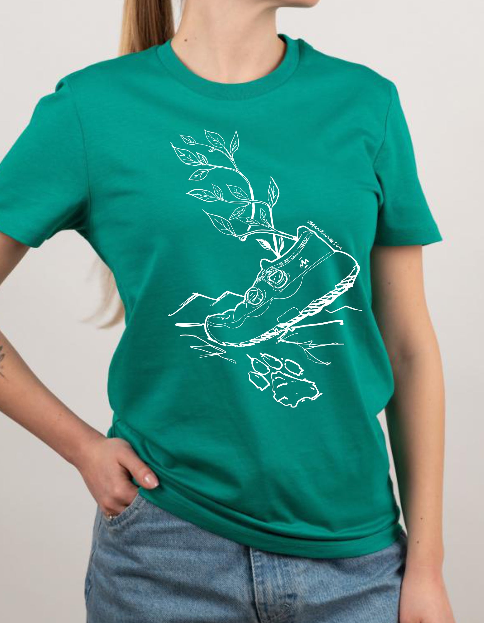 Person wearing a green t-shirt with a white graphic design created by Vegan Runners Ukraine on a plain background